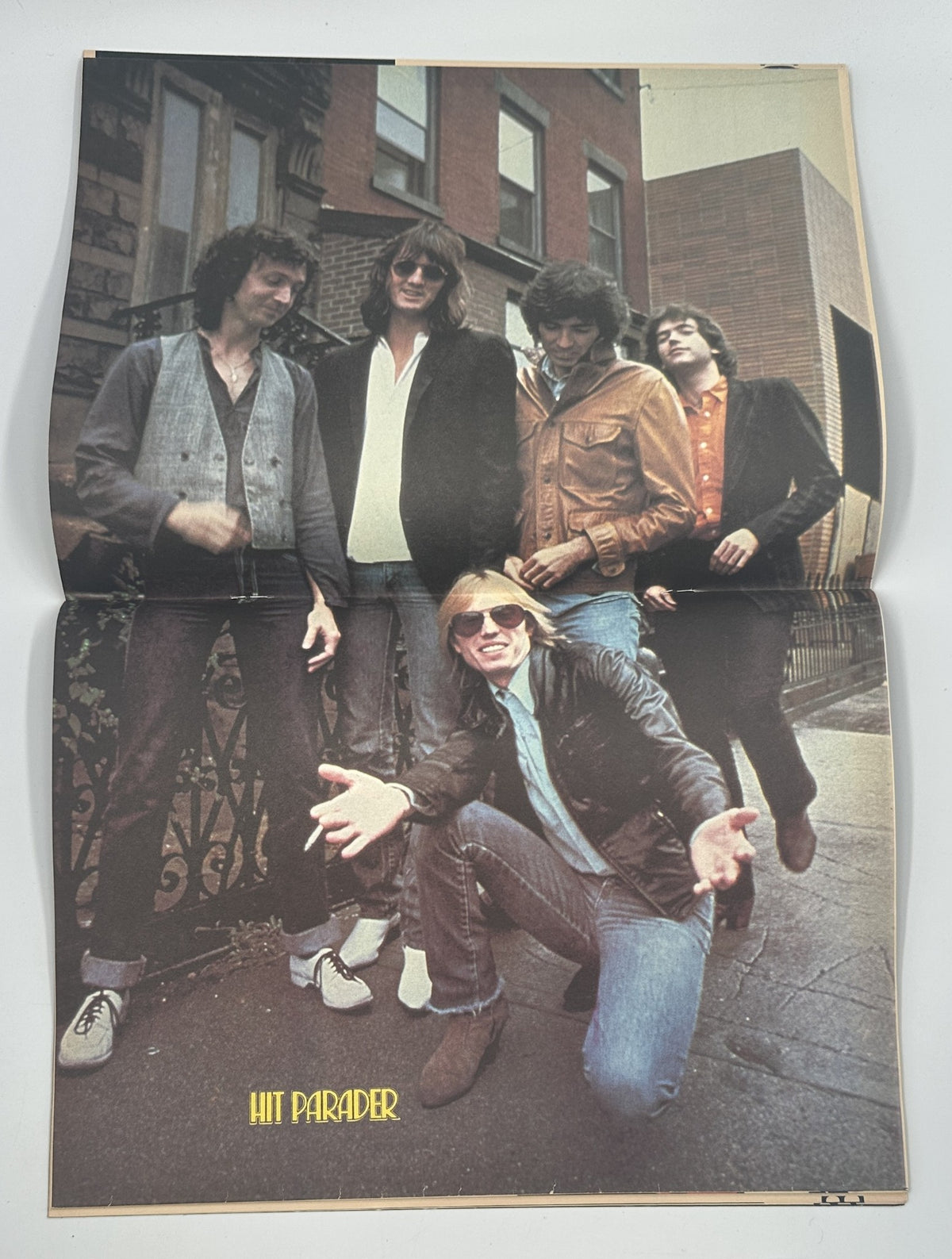 Hit Parader Magazine May 1980 cover featuring a group of five musicians in casual attire, posing outdoors, celebrating rock culture.