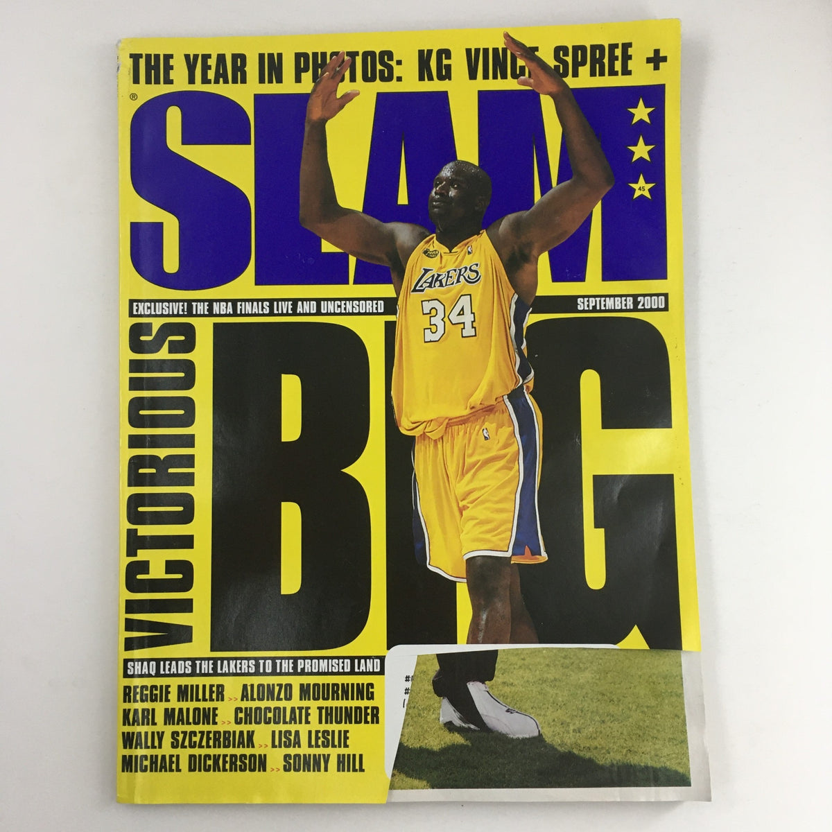 Cover of Slam Magazine September 2000 #45 featuring NBA legend Shaquille O'Neal wearing his Lakers jersey, showcasing the title 'Slam Big' with vibrant graphics.