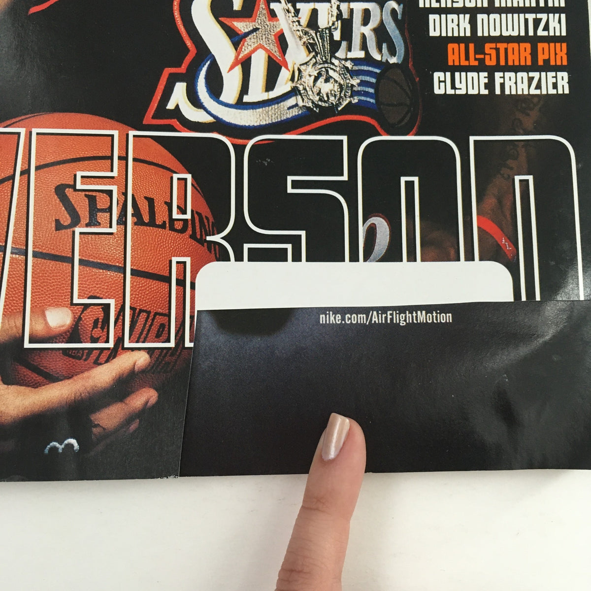 Cover of Slam Magazine May 2000 featuring Allen Iverson with a basketball, showcasing his impact on the sport.