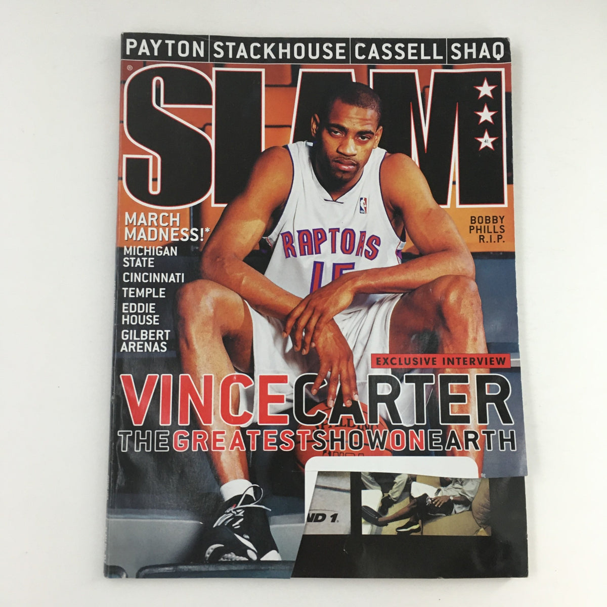 Slam Magazine April 2000 featuring Vince Carter on the cover, showcasing his exclusive interview. This issue highlights NBA legend Bobby Phills as well, making it a significant collectible for basketball fans.