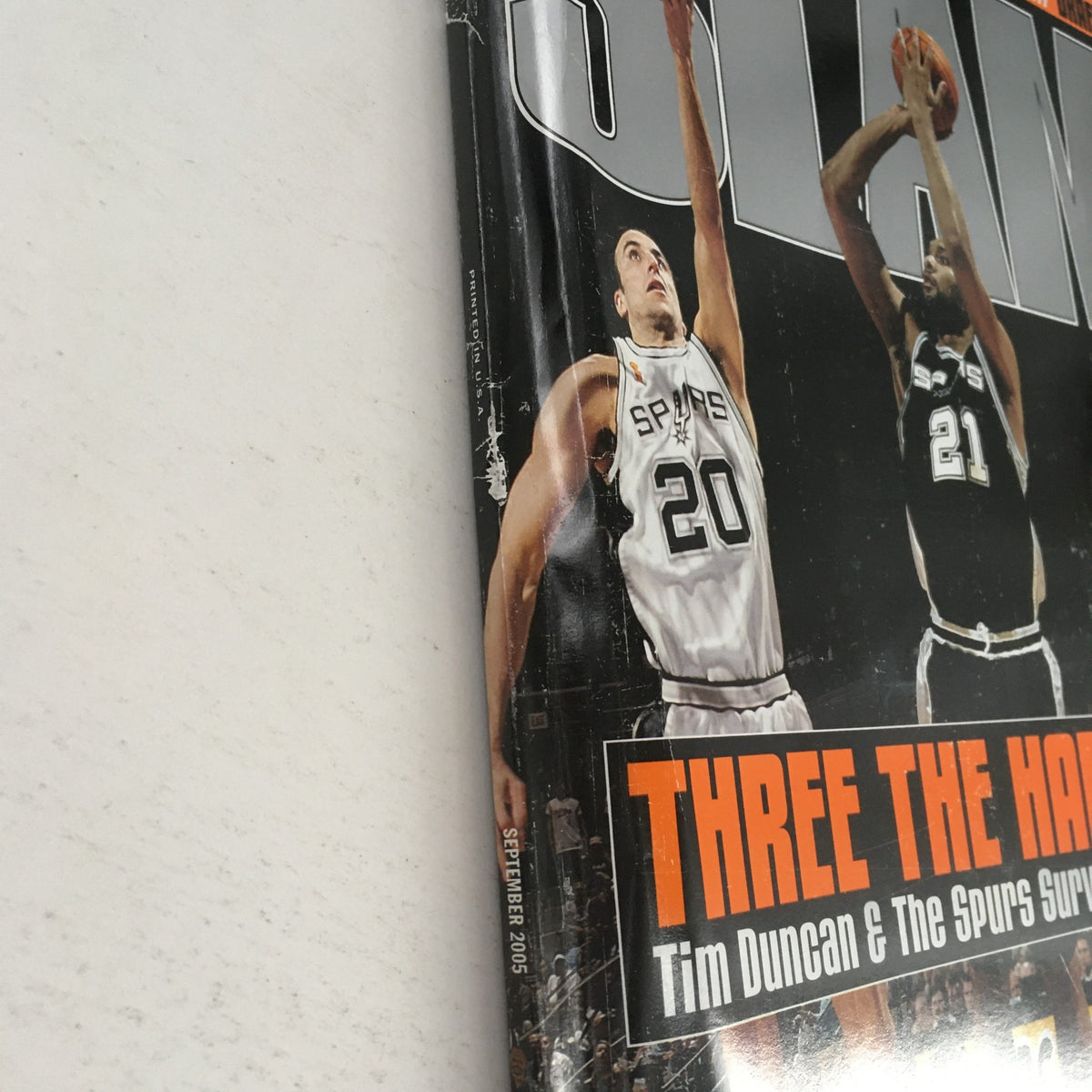 Close-up of the September 2005 Slam Magazine showcasing Tim Duncan and Manu Ginóbili, highlighting the title 'Three the Hard Way'.