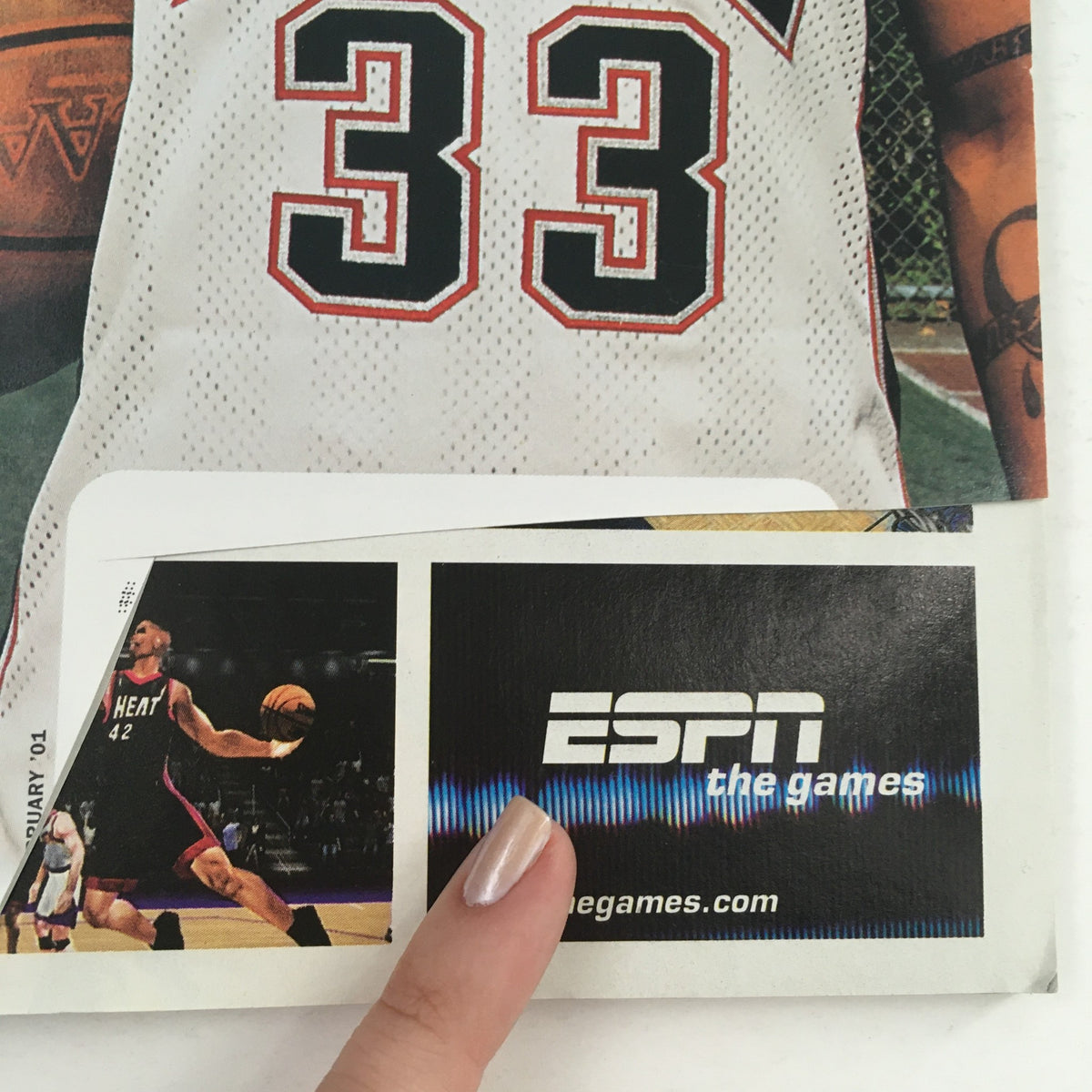 Close-up image of the back cover of Slam Magazine February 2001 with a focus on the 'ESPN the games' advertisement and the jersey number 33 of Stephon Marbury.