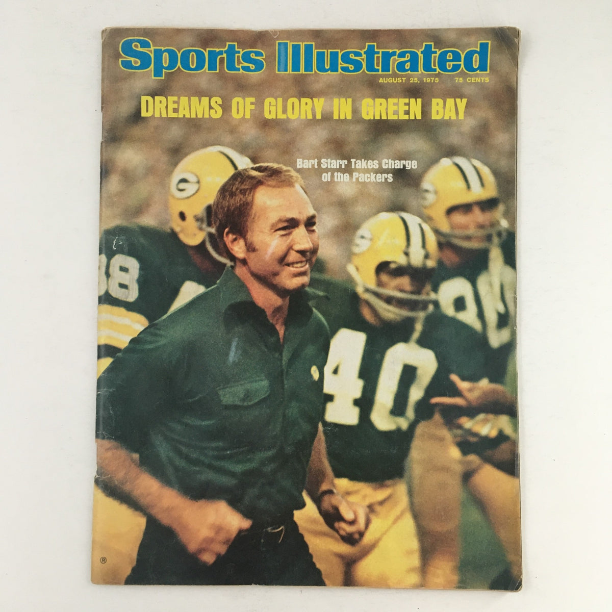 Sports Illustrated Magazine from August 25, 1975, featuring Bart Starr Takes Charge of the Packers. This cover showcases Starr in action on the field, emphasizing his leadership role in the Green Bay Packers team.