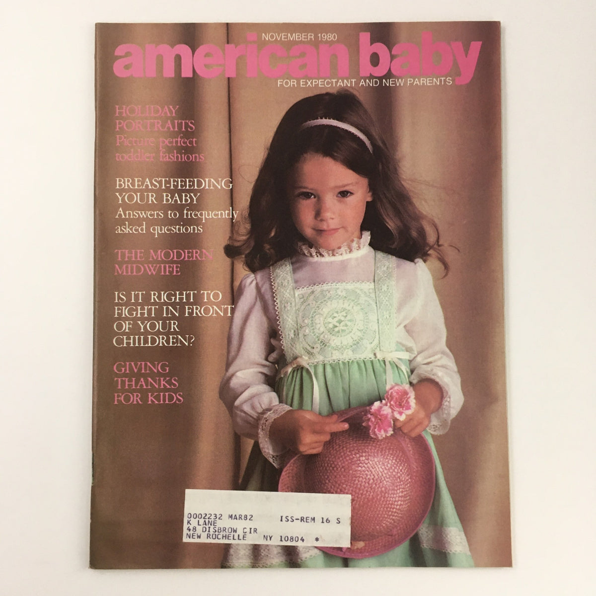 Cover of American Baby Magazine from November 1980 featuring the title 'American Baby for Expectant and New Parents'. The cover displays a young girl in a white and mint green dress holding a pink hat, alongside text segments highlighting articles on modern midwifery and parenting tips.
