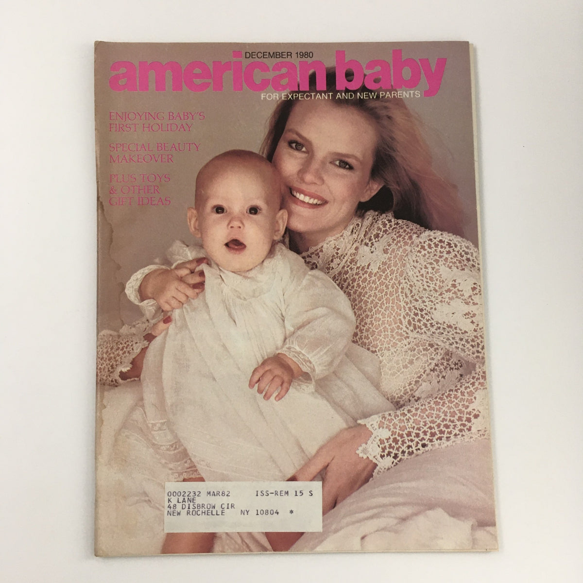 Cover of American Baby Magazine December 1980 featuring a mother holding her baby, highlights on enjoying baby's first holiday and special beauty makeover.