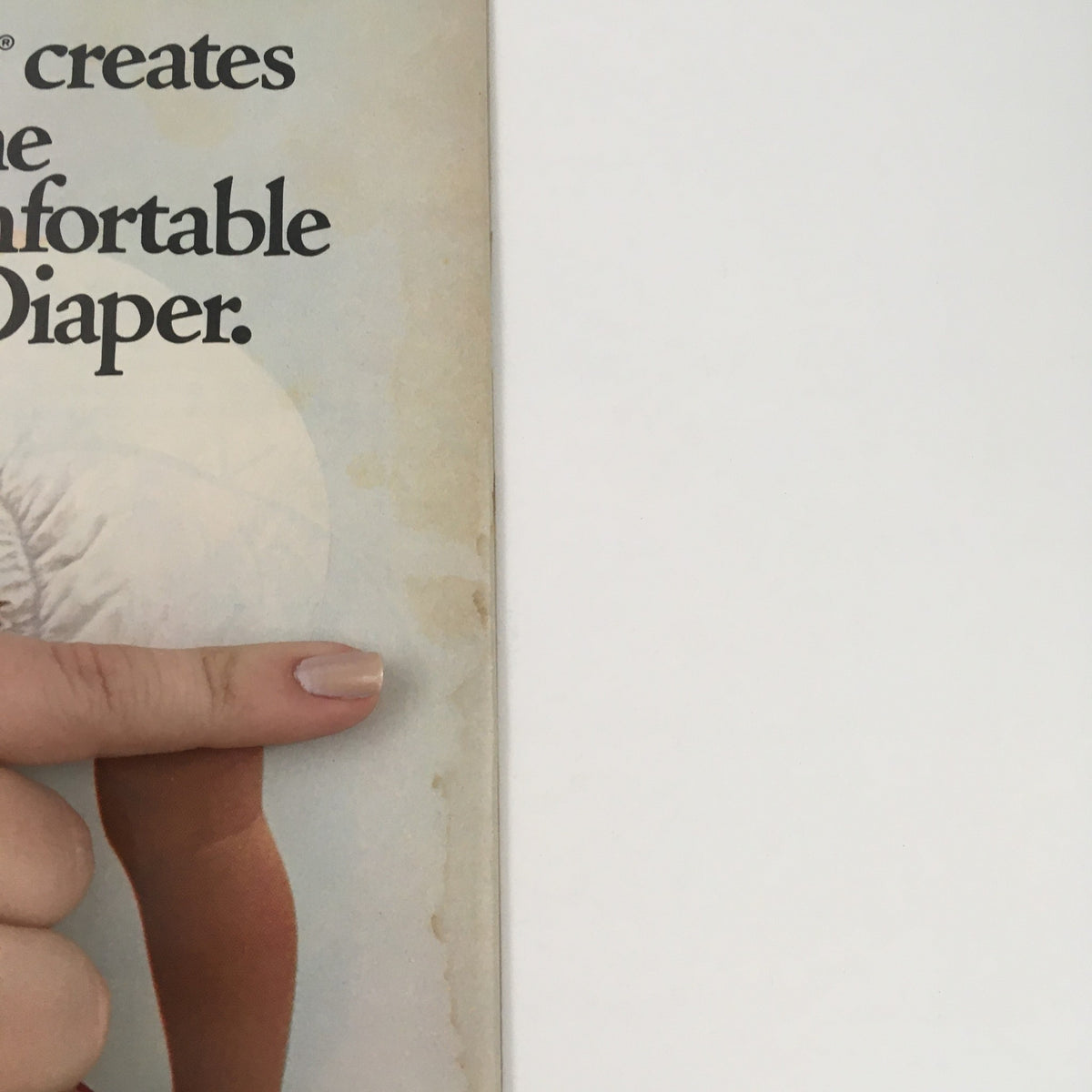 Side of American Baby Magazine January 1981 showing a finger pointing at a section about comfortable diapers, an essential topic in parenting.