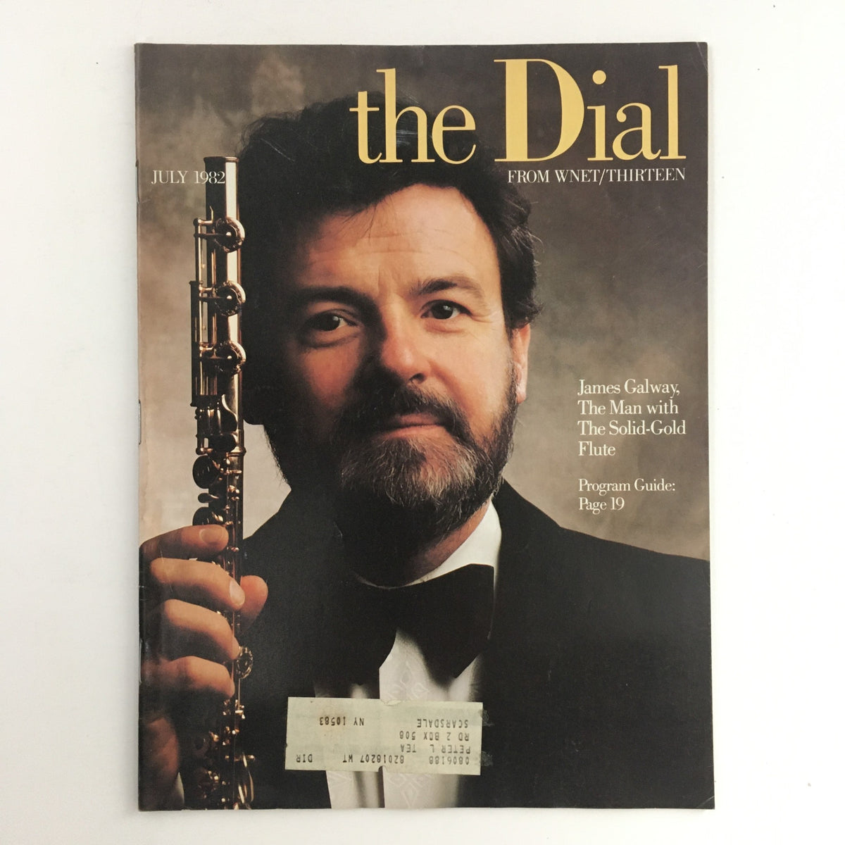 The Dial Magazine from July 1982 featuring James Galway, known as 'The Man with the Solid-Gold Flute'. The cover portrays Galway holding his flute, highlighting his iconic image as a renowned flutist. The magazine showcases insights into his musical artistry and cultural significance, making it a collectible for vintage magazine enthusiasts.