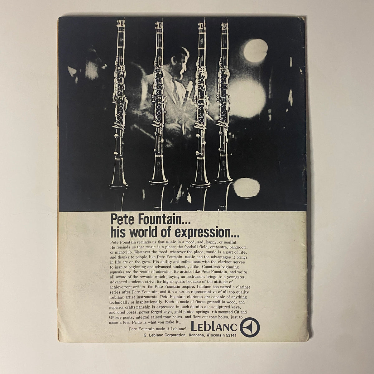 Back cover of Down Beat Magazine November 28, 1968, showcasing a promotional advertisement for Pete Fountain, emphasizing his influence in jazz music with visual representations of clarinets.