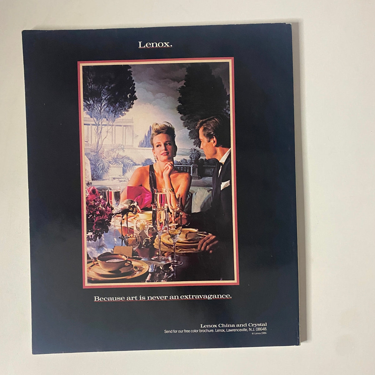 Vintage advertisement featuring a glamorous dinner setting with a man and woman, promoting Lenox china and crystal. The scene captures elegance and sophistication, alongside the tagline 'Because art is never an extravagance'. Related to the Connoisseur Magazine August 1987 issue with theme 'Abuzzy Over Honey', highlighting fine living and luxury.