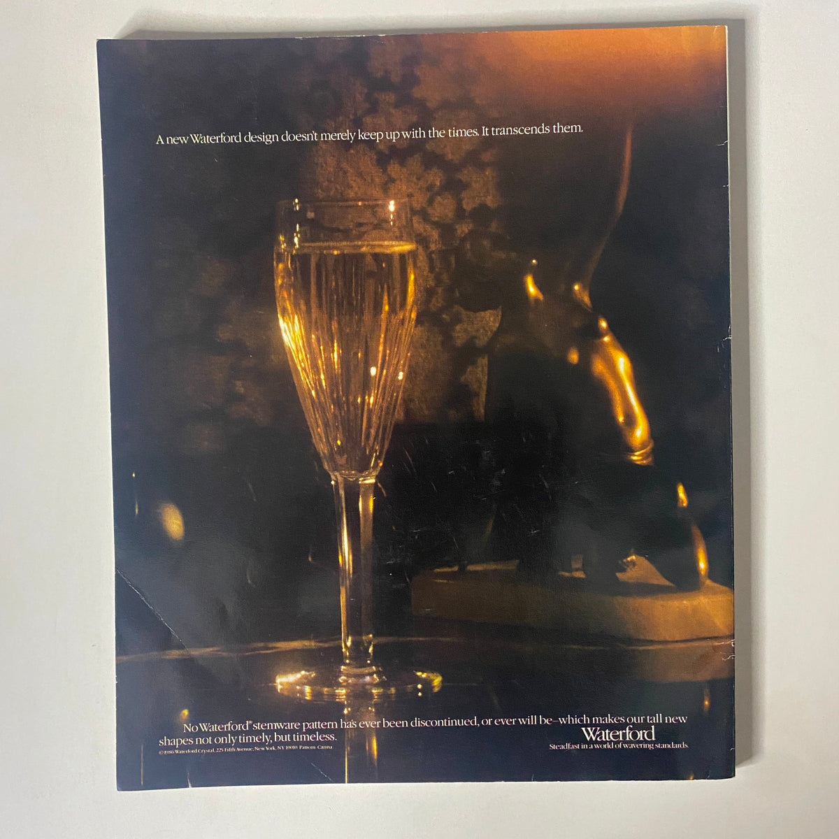 Back cover of Connoisseur Magazine September 1986 featuring a Waterford advertisement with a luxurious glass design, accentuating timeless elegance.