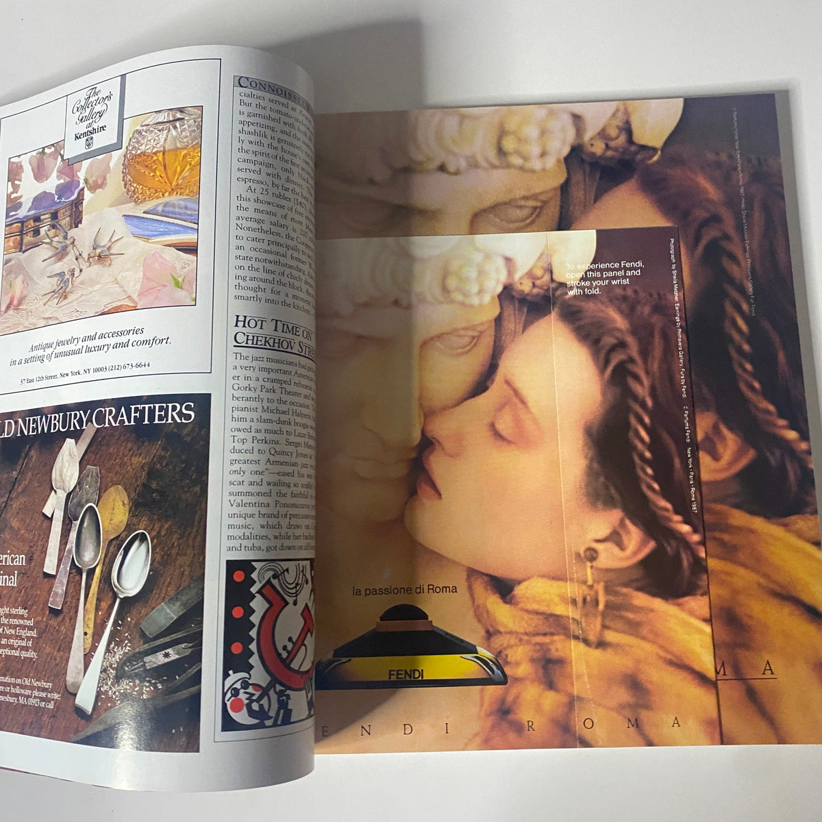 Connoisseur Magazine November 1987 ad showcasing Fendi with an artistic depiction of a woman and classical sculptures, emphasizing luxury and elegance.