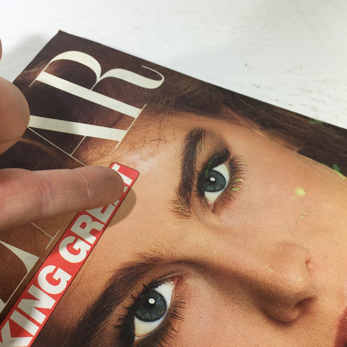 Close-up of the VTG Harper's Bazaar Magazine: August 1981 cover showing the 'LOOKING GREAT' promotion and Brooke Shields' striking features.