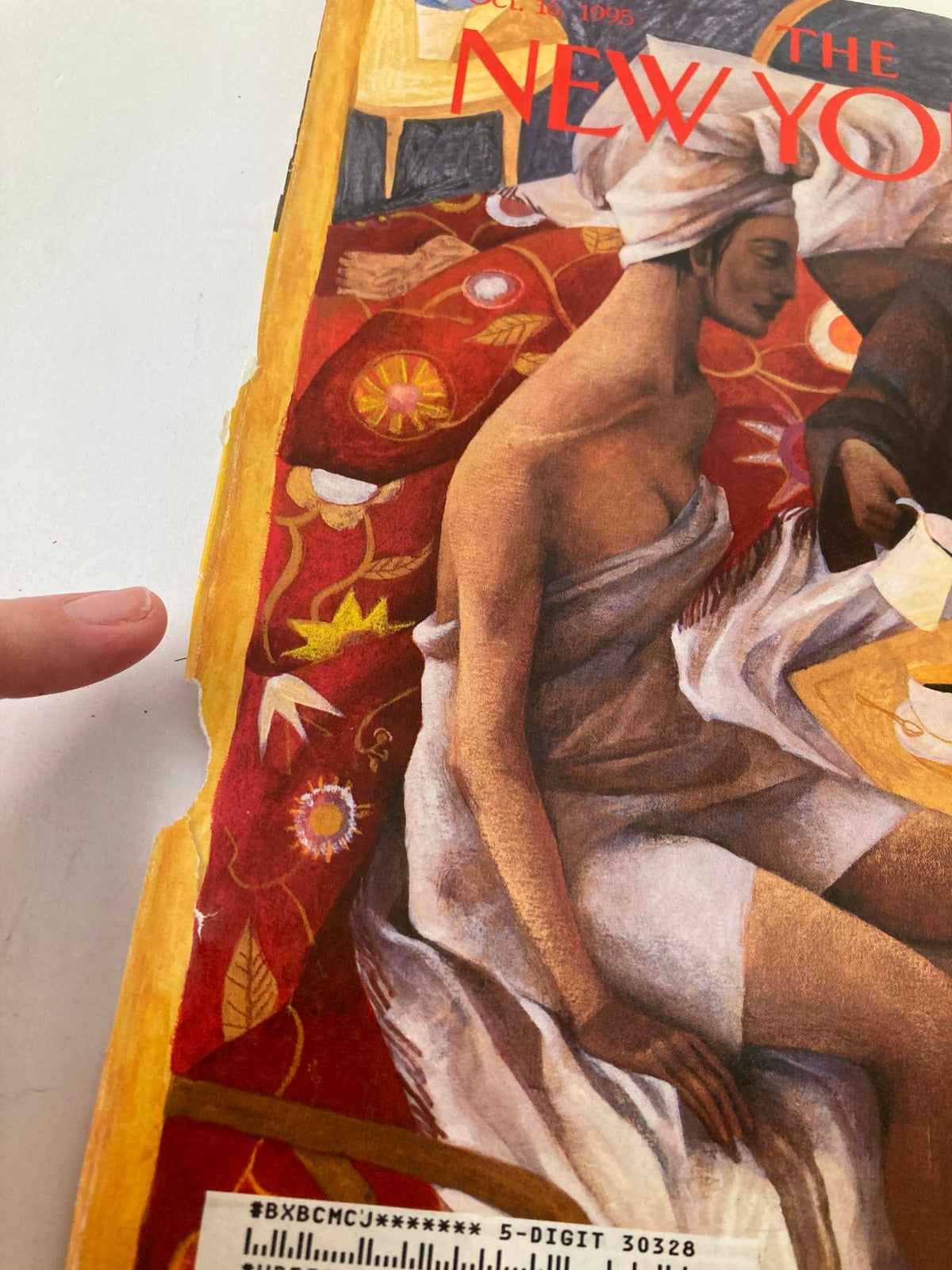 Close-up of the damaged edge of The New Yorker Cover Only 'Where the Heart Is' by Ana Juan, highlighting signs of vintage wear while maintaining the artistic essence, dated October 16, 1995.