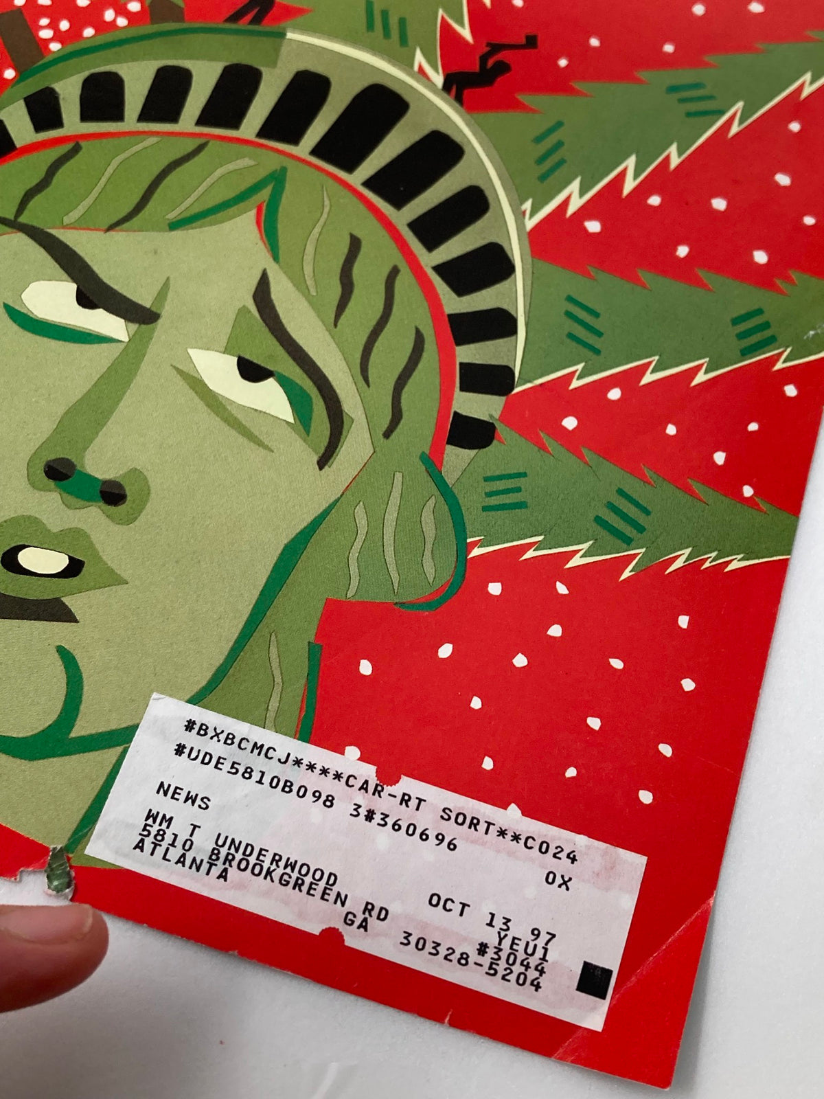 Close-up of The New Yorker December 9, 1996 cover 'Christmas Chopping,' highlighting the Statue of Liberty with festive elements and a price tag.