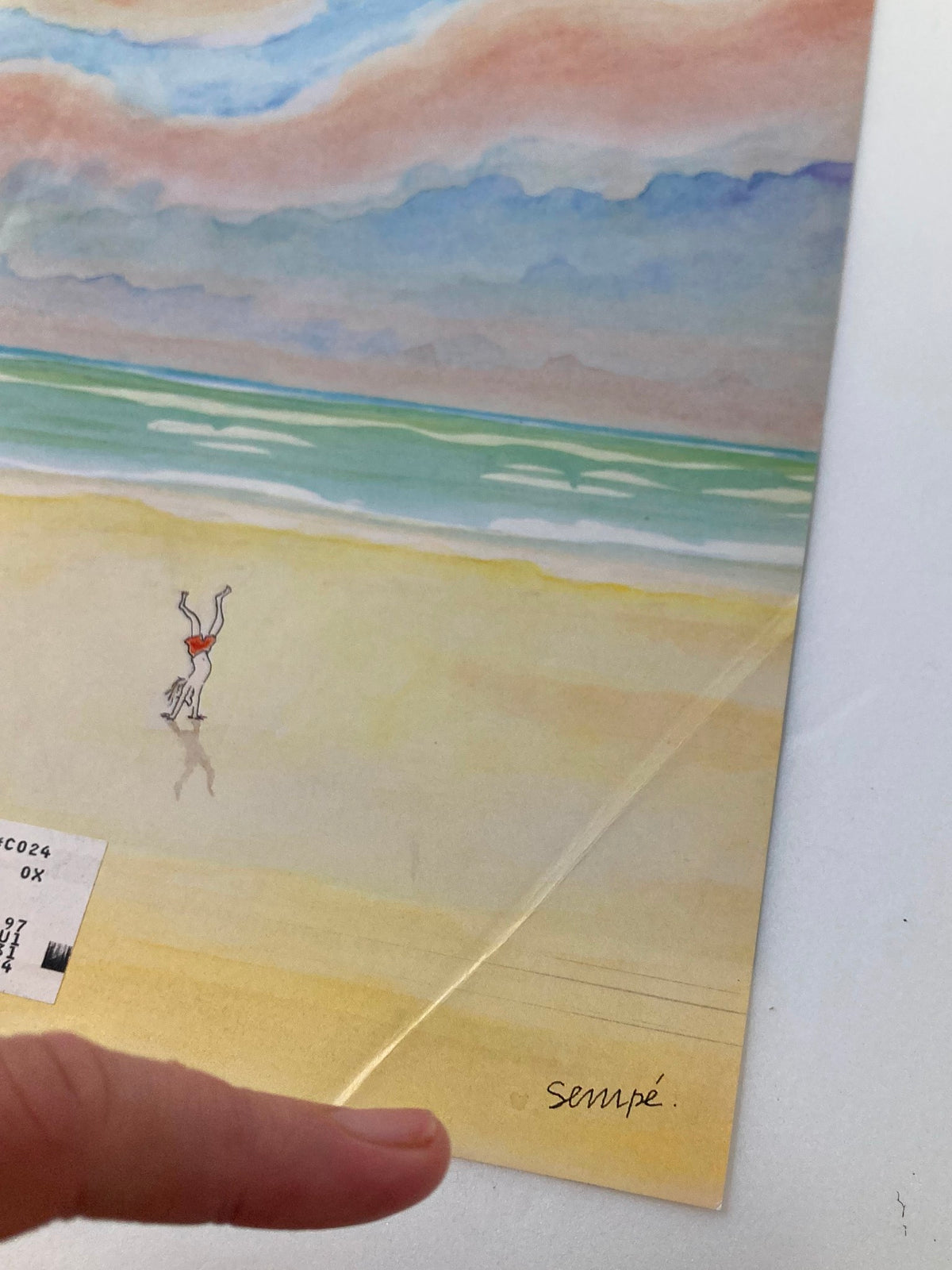 Close-up view of The New Yorker cover from August 11, 1997, highlighting the whimsical illustration by J. J. Sempé, depicting a beach scene with colorful skies.