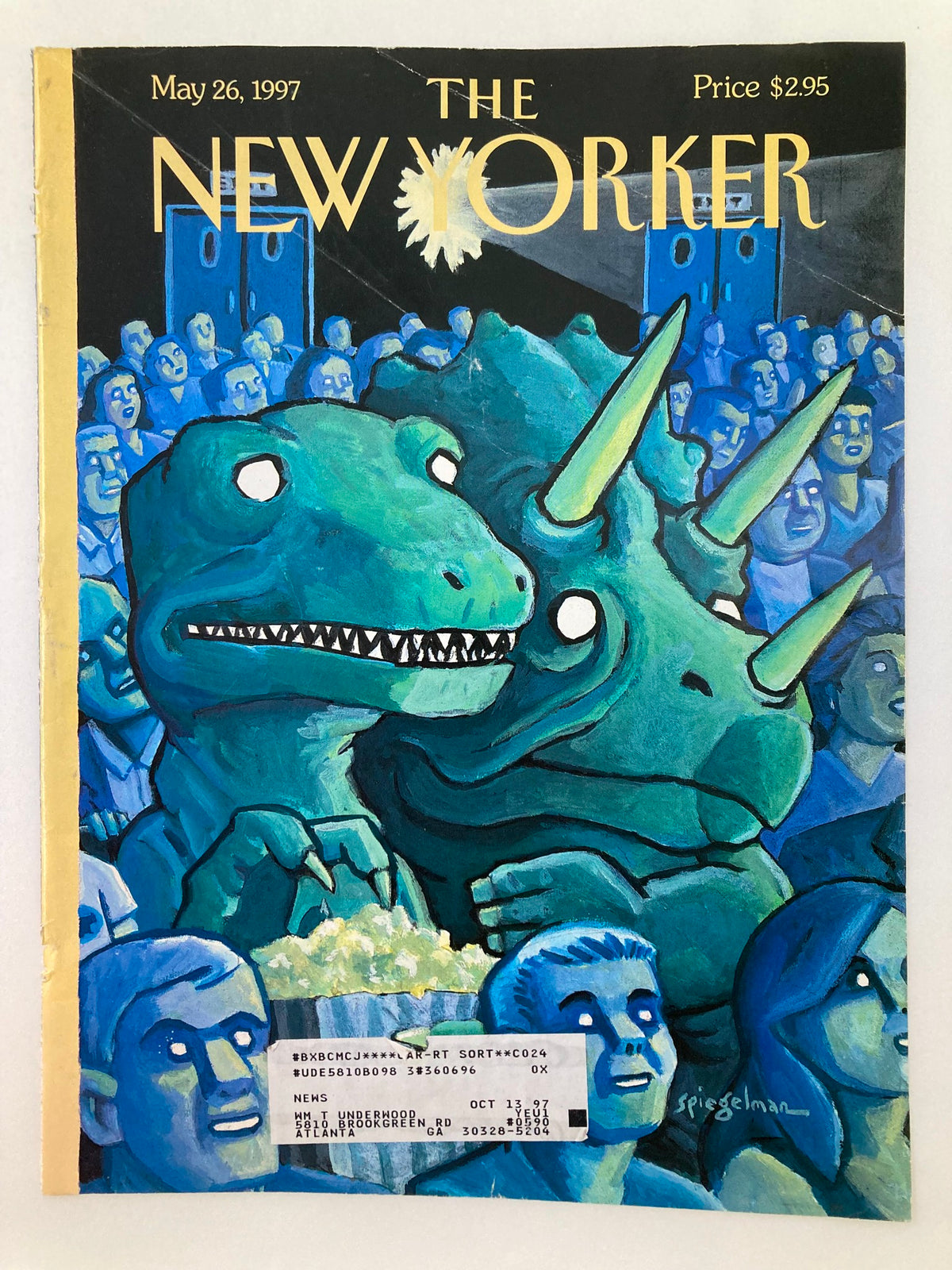 Close-up view of The New Yorker cover from May 26, 1997, illustrated by Art Spiegelman, showcasing two dinosaurs in a theater setting with popcorn, highlighting the artistic details and condition.