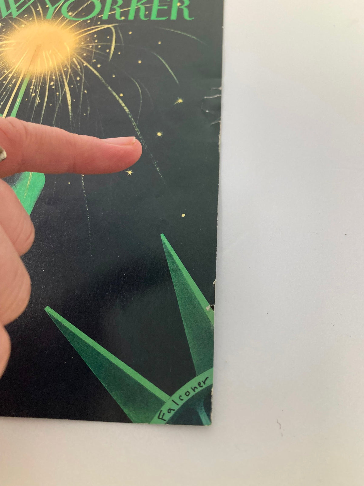 Close-up of The New Yorker cover from July 8, 1996, highlighting the illustration 'Liberated' by Ian Falconer, with a finger pointing to the artist's signature.