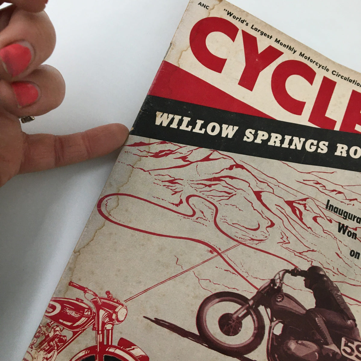 Close-up view of the cover of VTG Cycle Magazine June 1954 showcasing the title 'Willow Springs Road Race' and a motorcycle illustration.