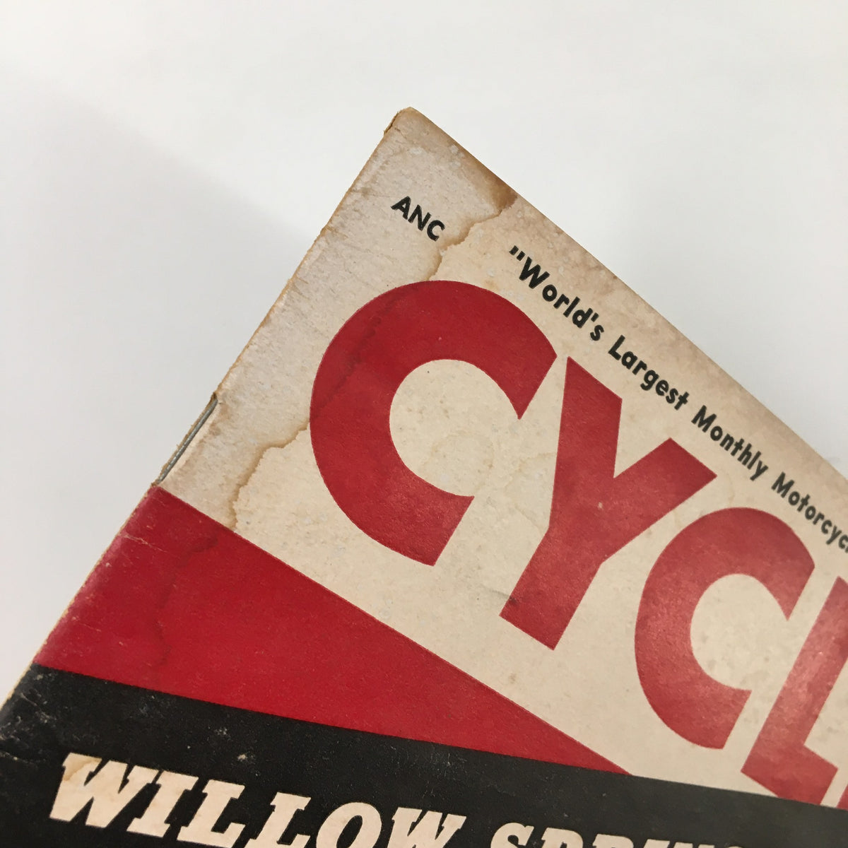 Angle shot of the top of the VTG Cycle Magazine June 1954, featuring the bold title 'CYCLE' and a tagline about being the world's largest monthly motorcycle magazine.