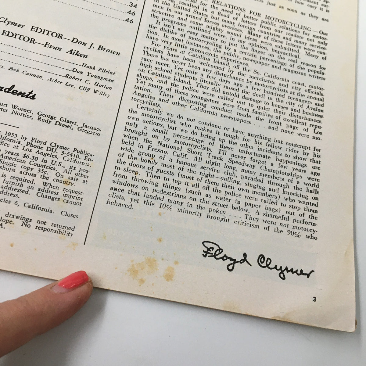 Close-up of the signature of Floyd Clymer on the December 1955 Cycle Magazine, which includes important editorial notes and historical context about motorcycling in the 1950s.