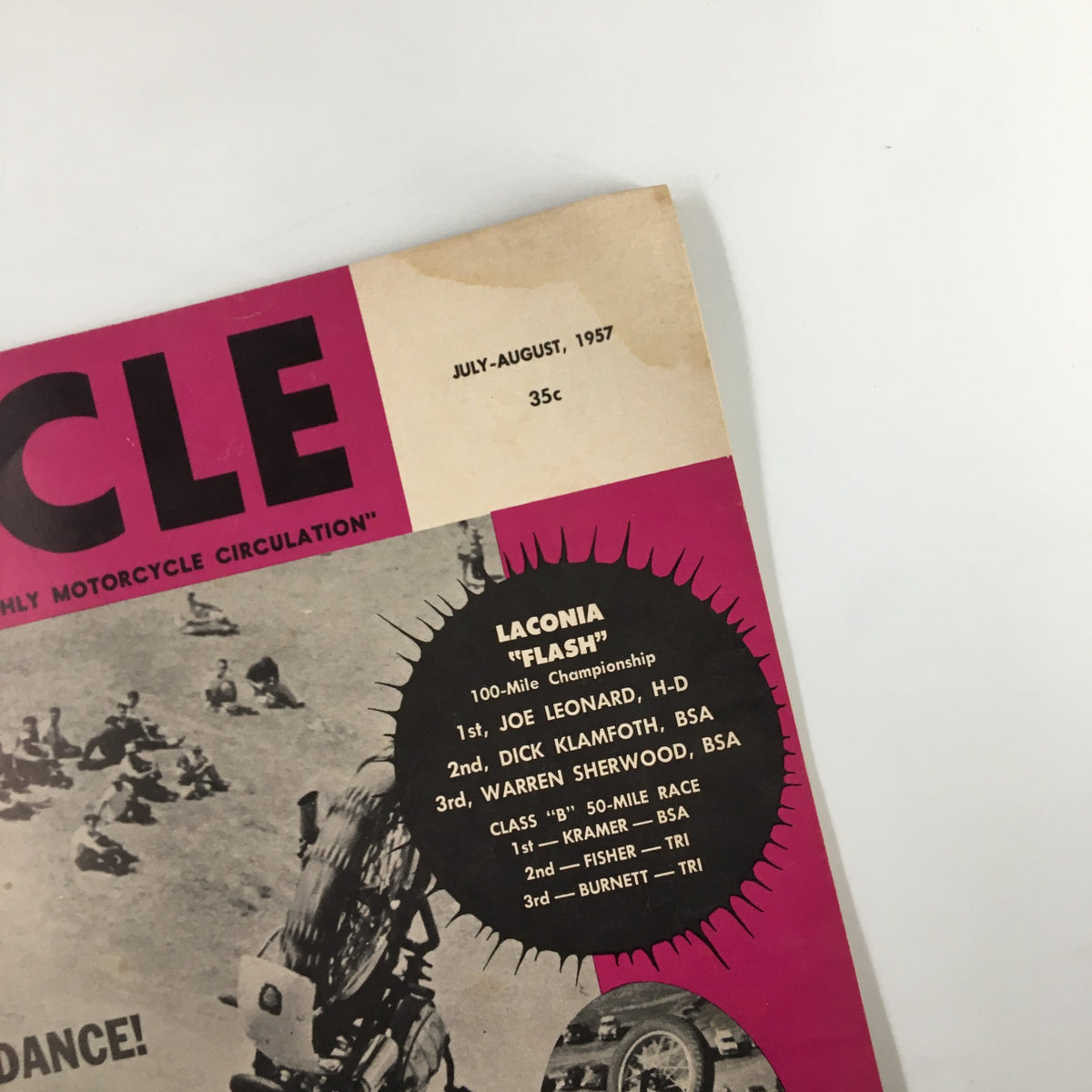 Close-up of VTG Cycle Magazine July 1957 Third Cyclist Spectacle Approaching cover highlighting the 'Laconia FLASH' motorcycle race details and winners listed.