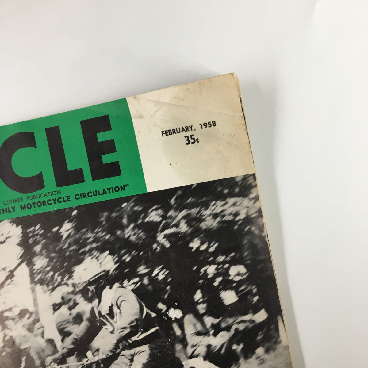 Close-up of the top corner of VTG Cycle Magazine February 1958, displaying the publication date and price.