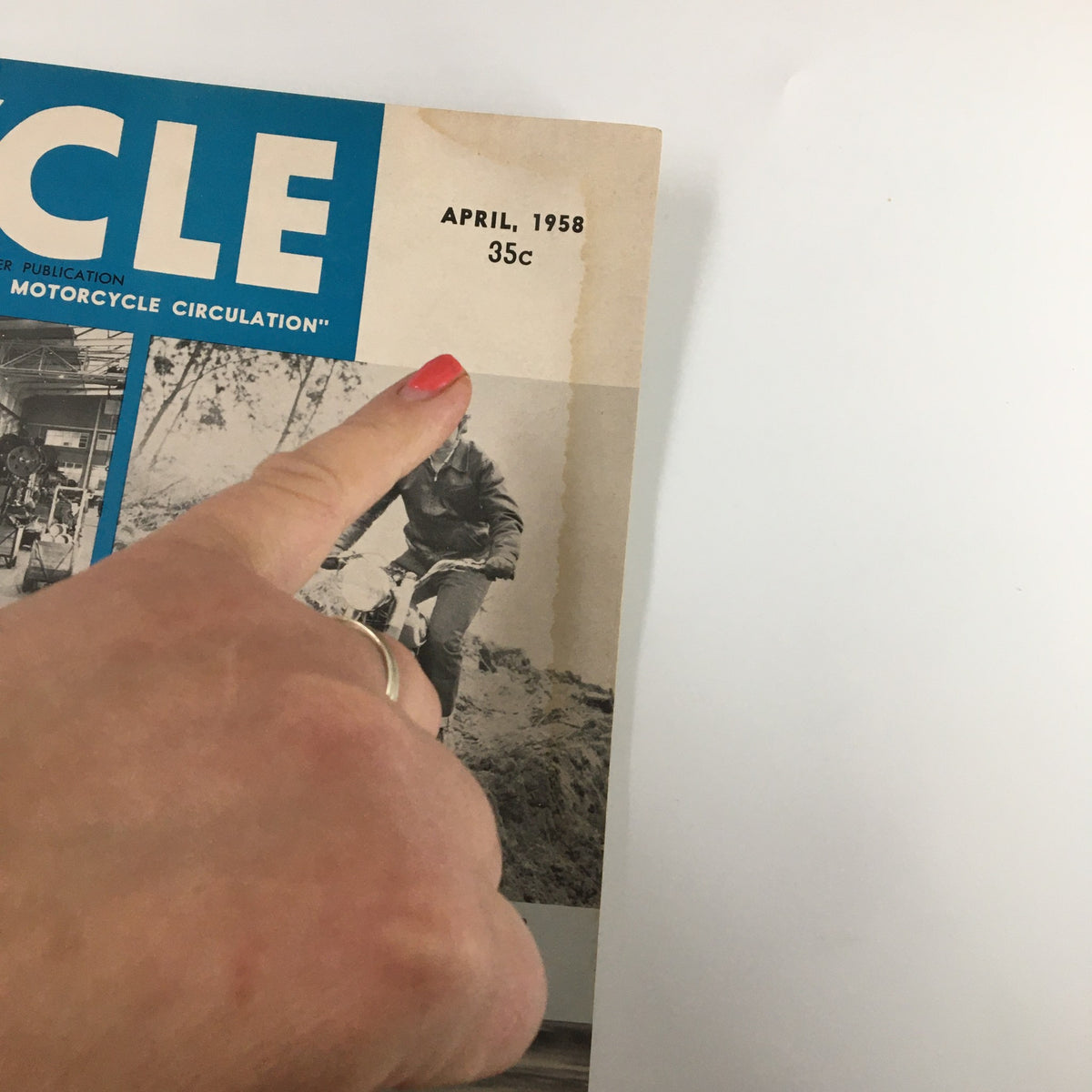 Close-up of the date and price on the cover of VTG Cycle Magazine April 1958, highlighting its historical significance for collectors.