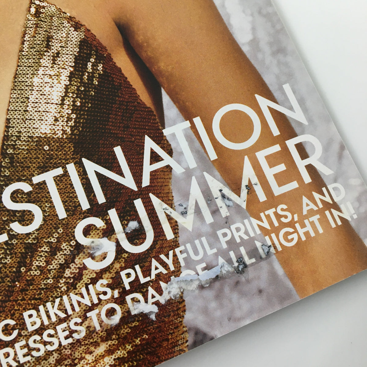 Close-up of Vogue Magazine June 2019 cover detail highlighting the text 'DESTINATION SUMMER,' emphasizing fashion trends like chic bikinis and playful prints.