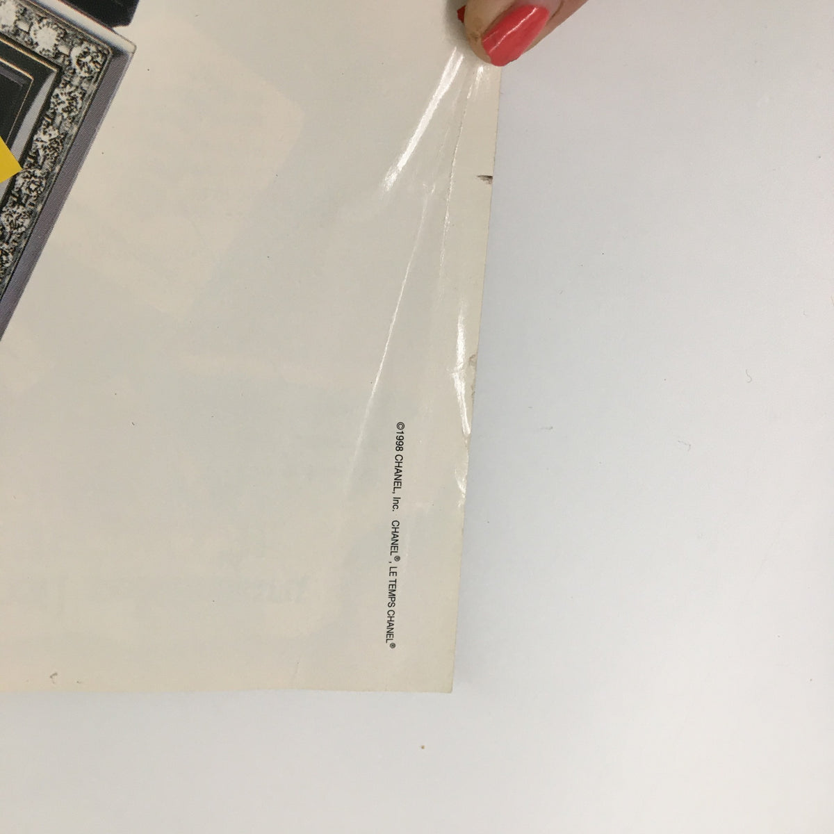 Close-up of the back cover of George Magazine November 1998 showing minor wear and Chanel logo, indicating its vintage status.