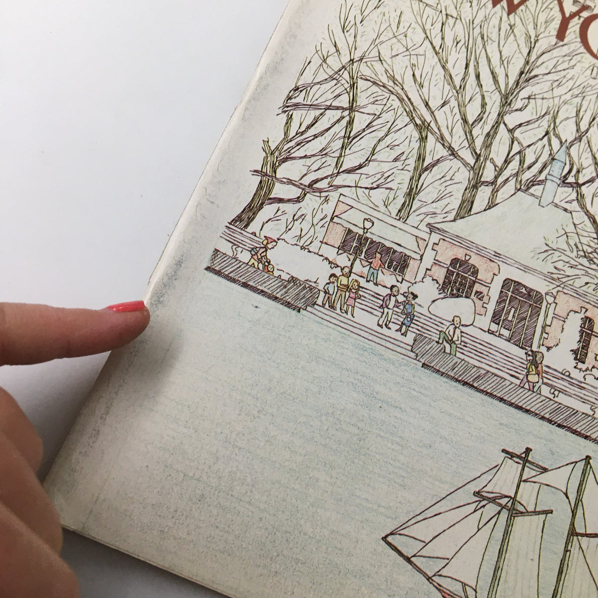 Close-up view of the edge of The New Yorker Magazine May 2 1983 featuring a colorful illustration of a sailing boat toy designed by Marisabina Russo, highlighting the magazine's nostalgic charm.