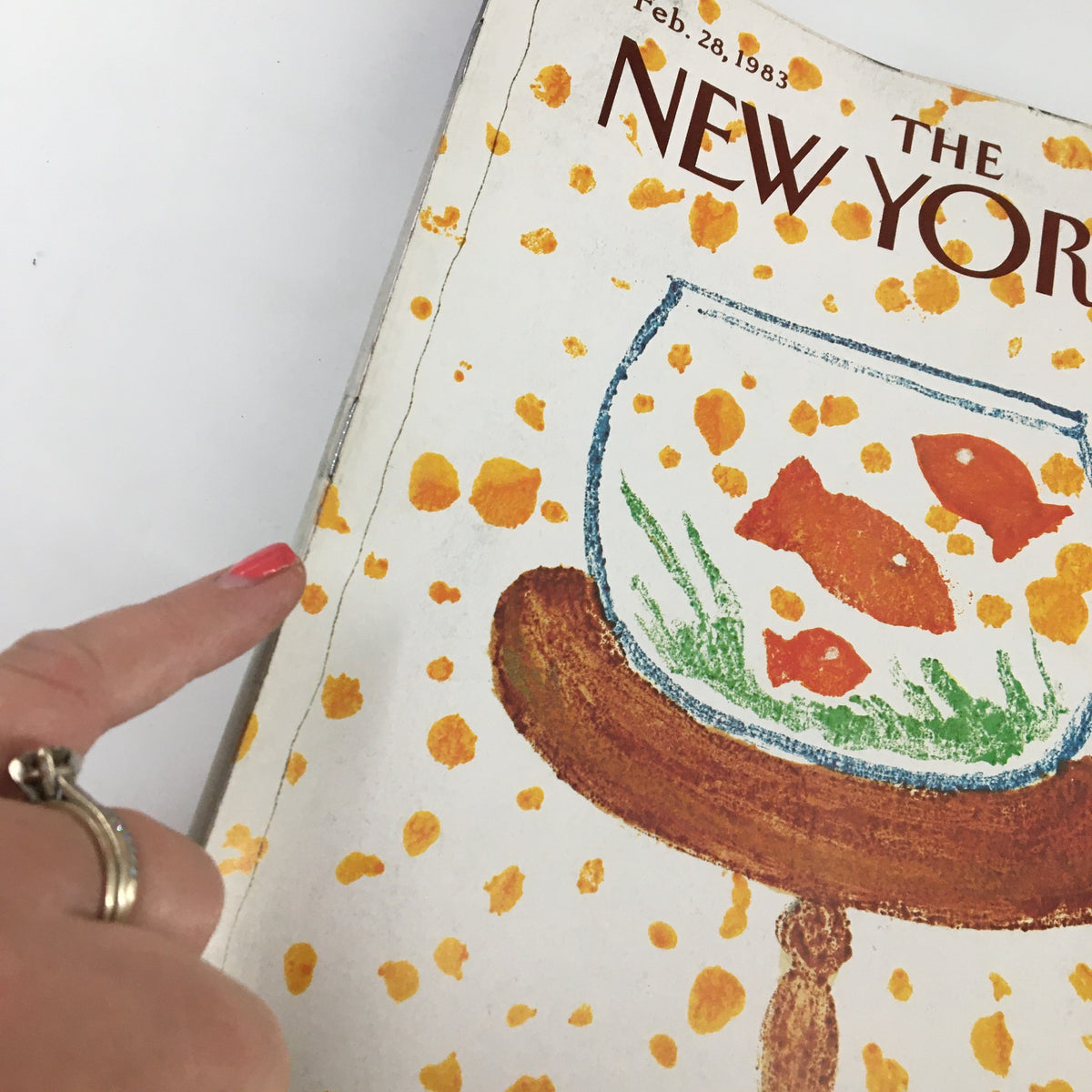 Close-up of The New Yorker Magazine February 28, 1983 cover, highlighting the vibrant 'Fish Bowl' artwork by Robert Tallon, with goldfish and colorful splashes.