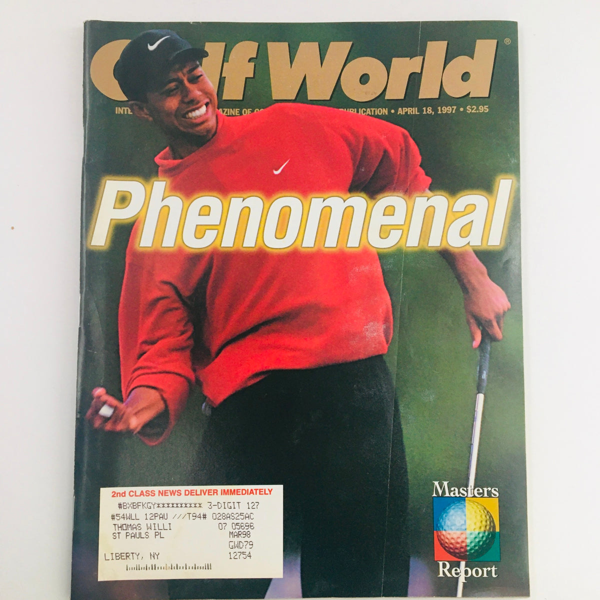 Golf World Magazine April 18 1997 featuring Tiger Woods in a red Nike sweater, smiling while holding a golf club. This vintage magazine captures a pivotal moment in Woods' early career.