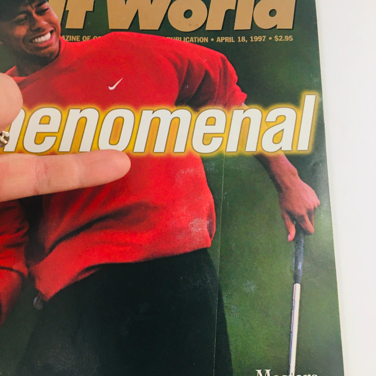 Close-up of the April 18 1997 issue of Golf World Magazine featuring Tiger Woods, showcasing the large headline 'Phenomenal' along with his bright red Nike attire.