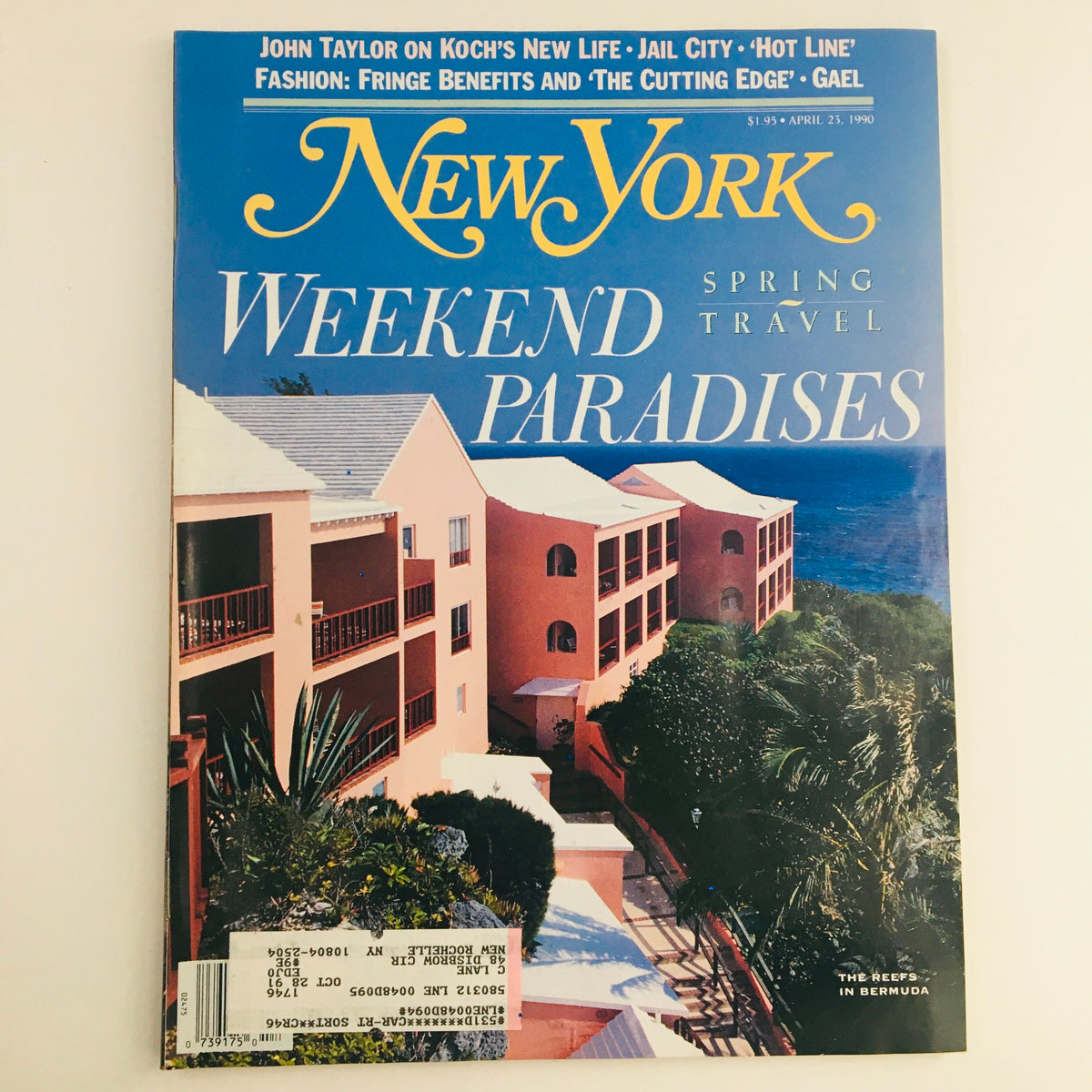 Cover of New York Magazine dated April 23, 1990, featuring the title 'Weekend Paradise' and a scenic view of The Reefs in Bermuda. The magazine showcases vibrant spring travel themes and highlights alluring vacation destinations.