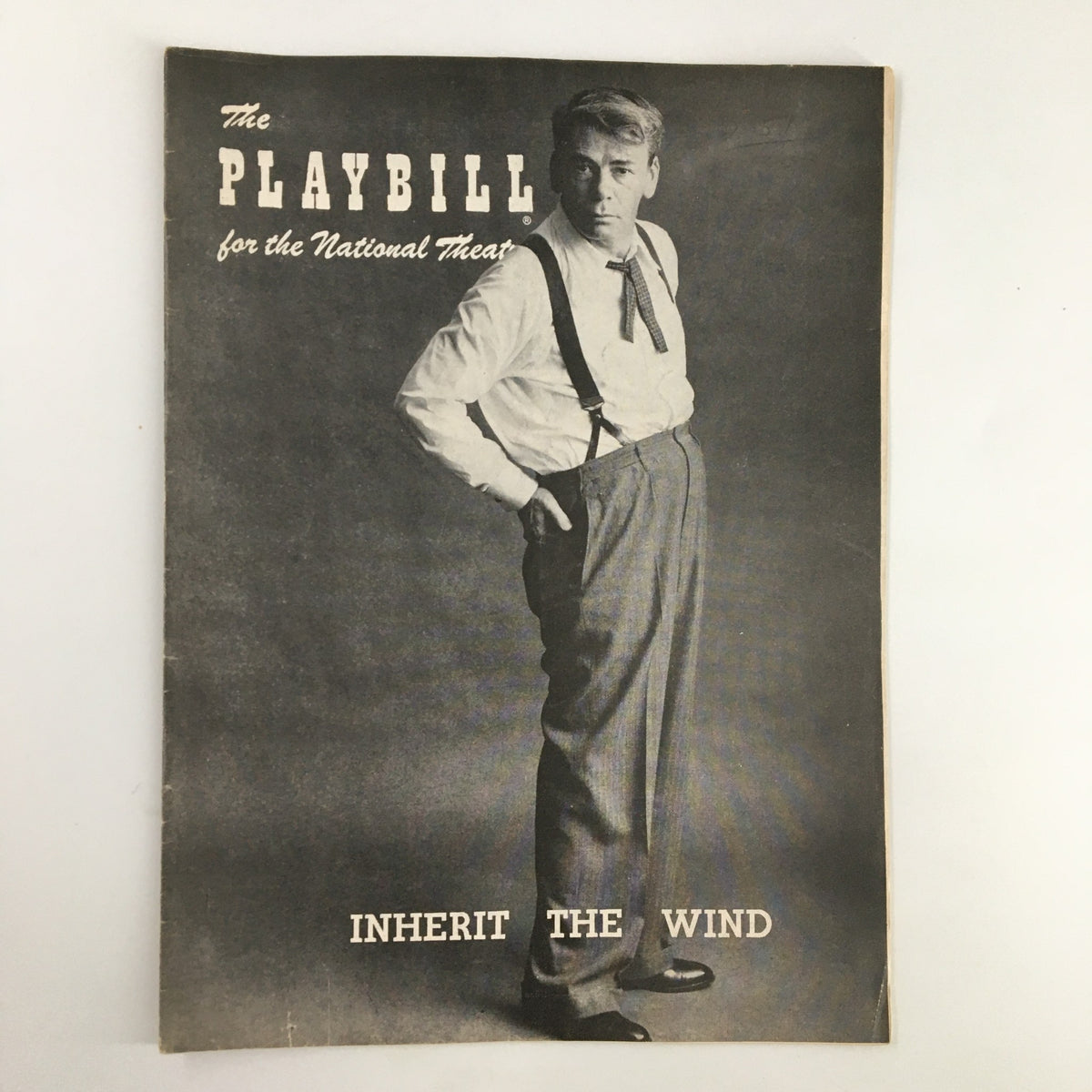 1957 Playbill National Theatre featuring Paul Muni in Inherit The Wind, showcasing the cover design and iconic imagery from the theatrical production.
