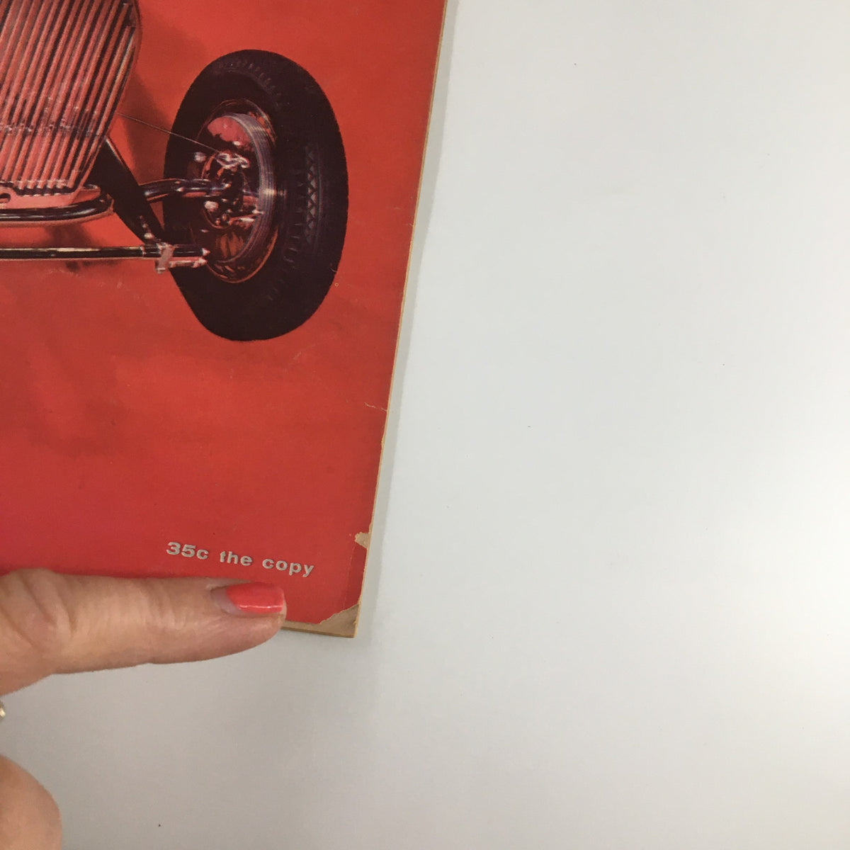Image of the vintage Road & Track Magazine from October 1957 highlighting the price tag and the cover featuring Mercedes 219 road test.