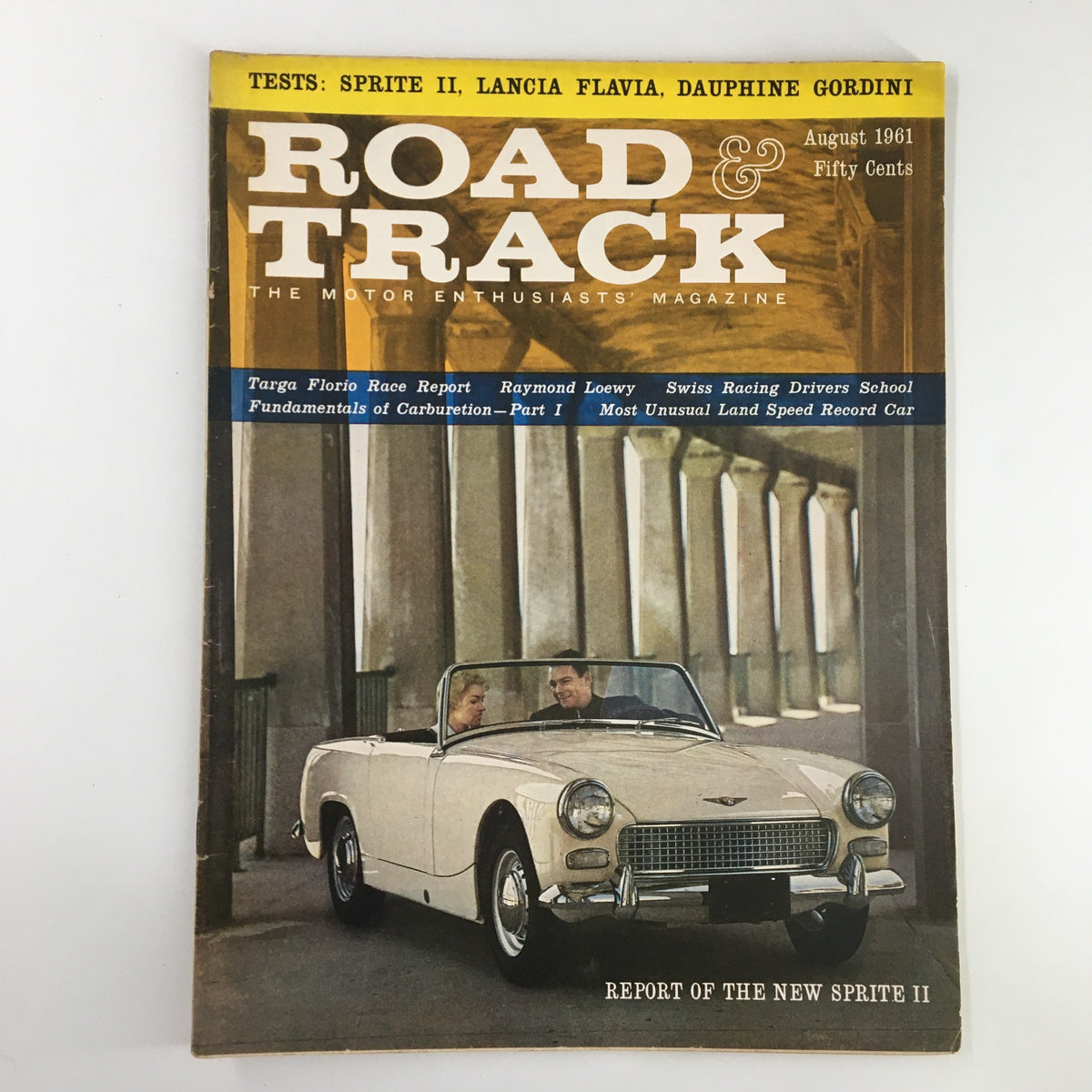 Road & Track Magazine August 1961 featuring a report on the New Sprite II, showcasing a vintage white convertible car with two people inside, highlighting classic automotive design and culture.