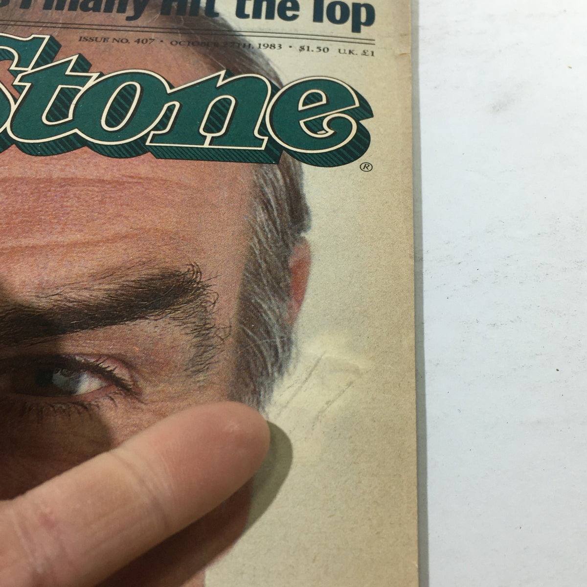 Close-up of a detail from the October 27, 1983 Rolling Stone cover featuring Sean Connery as The Real Bond 007, highlighting his eye and part of the magazine title.