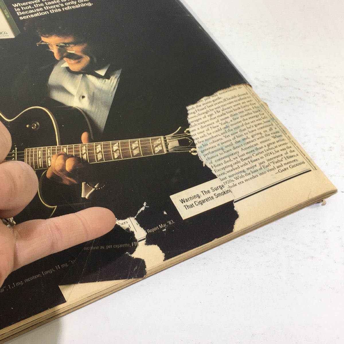Back cover of the Vintage Rolling Stone Magazine from June 23, 1983, featuring a guitar player and visible damages such as torn areas and wear.