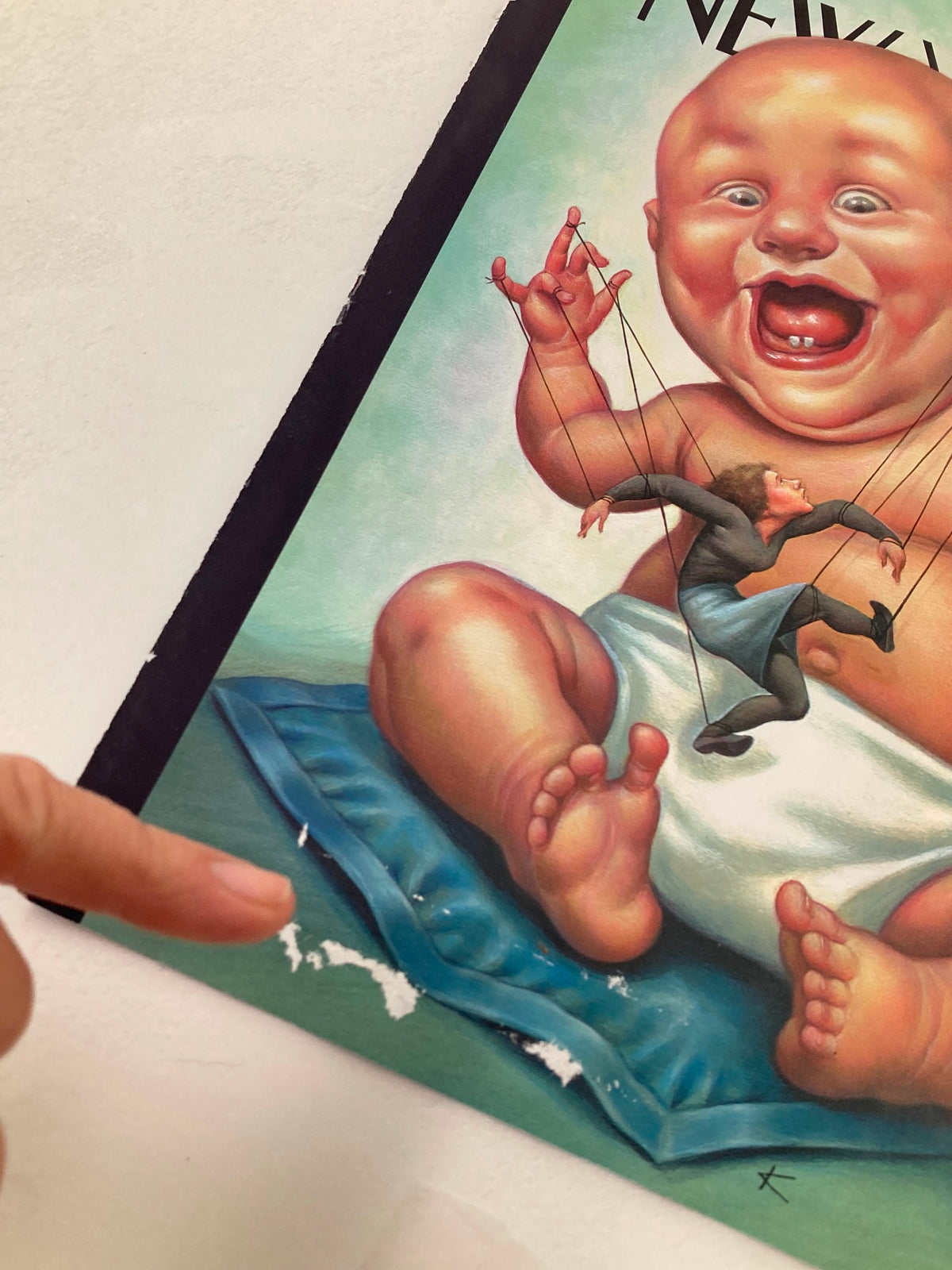 Cover art of The New Yorker May 14 2001 titled 'Baby Puppetmaster' by Anita Kunz, featuring a whimsical baby puppet with a marionette, showcasing vibrant colors and detailed illustration.