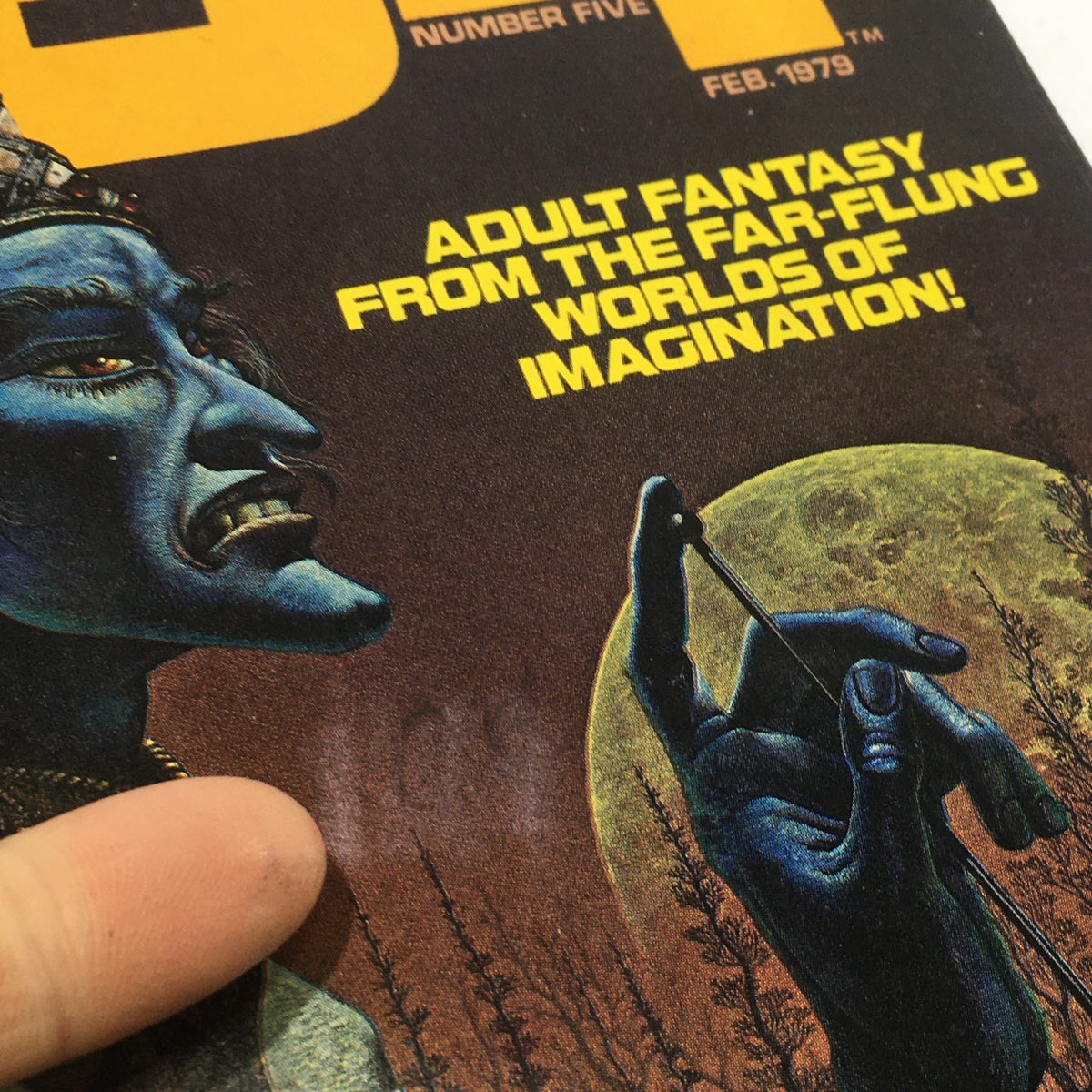 Close-up detail of the cover of VTG 1984 A Warren Magazine Number Five, showcasing a blue-skinned character holding a tool against a full moon backdrop, with the text 'Adult Fantasy from the Far-Flung Worlds of Imagination!'
