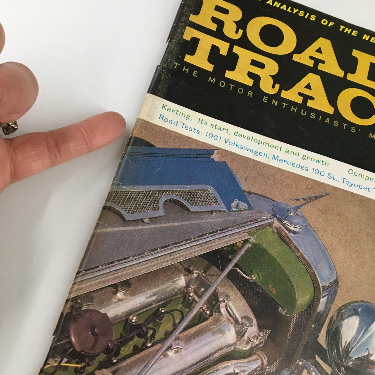 Close-up of the cover of VTG Road & Track Magazine December 1960 highlighting the Duesenberg Model J, with notable emphasis on the engine compartment and magazine logo.