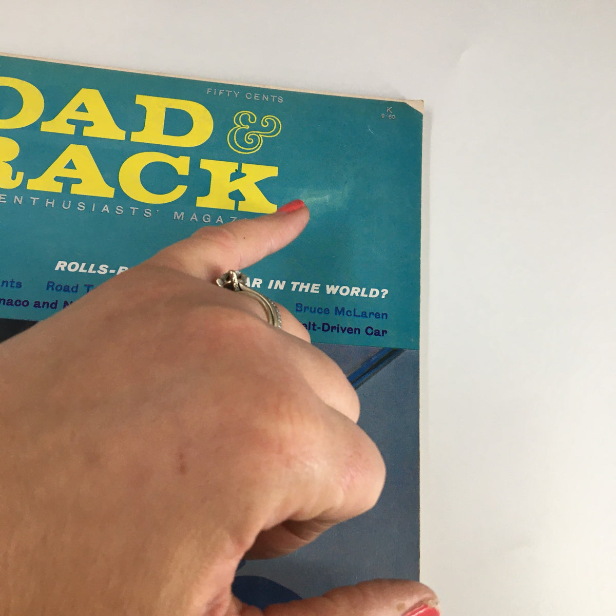 Close-up view of the VTG Road & Track Magazine September 1960 cover, highlighting the title and iconic wording about Rolls-Royce.