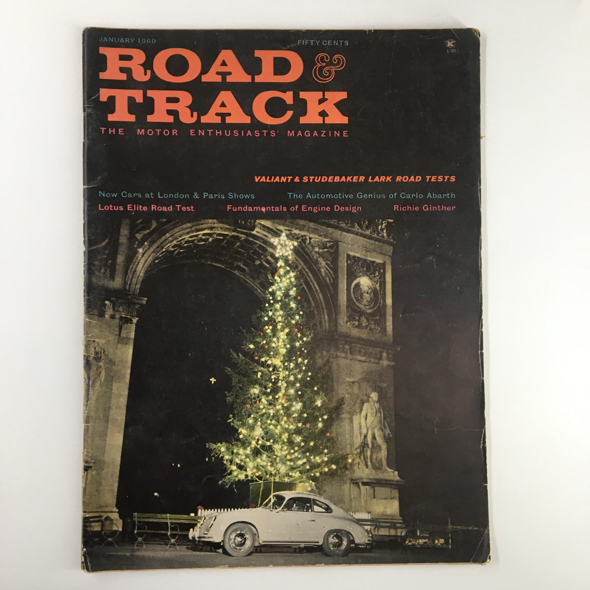 Cover of VTG Road & Track Magazine January 1960 featuring Valliant and Studebaker Lark with festive holiday decorations and a classic car.