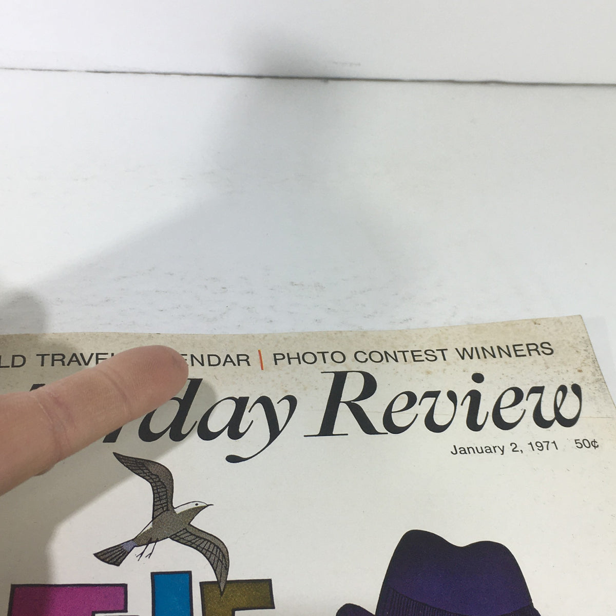 Another angle of the VTG Saturday Review: January 2 1971 - World Travel Issue cover, showcasing the title 'The Politics of Pleasure' alongside imagery of travel-related items.