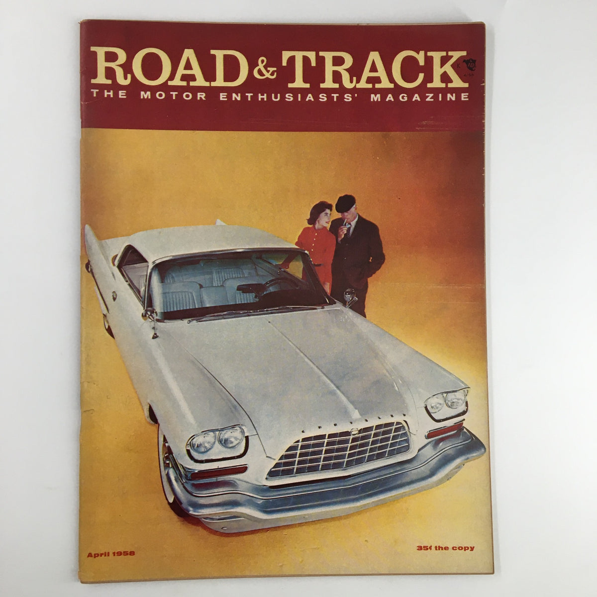 Cover of VTG Road & Track Magazine April 1958 featuring a classic silver car and two individuals, showcasing the Austin-Healey Mille Miglia road test.