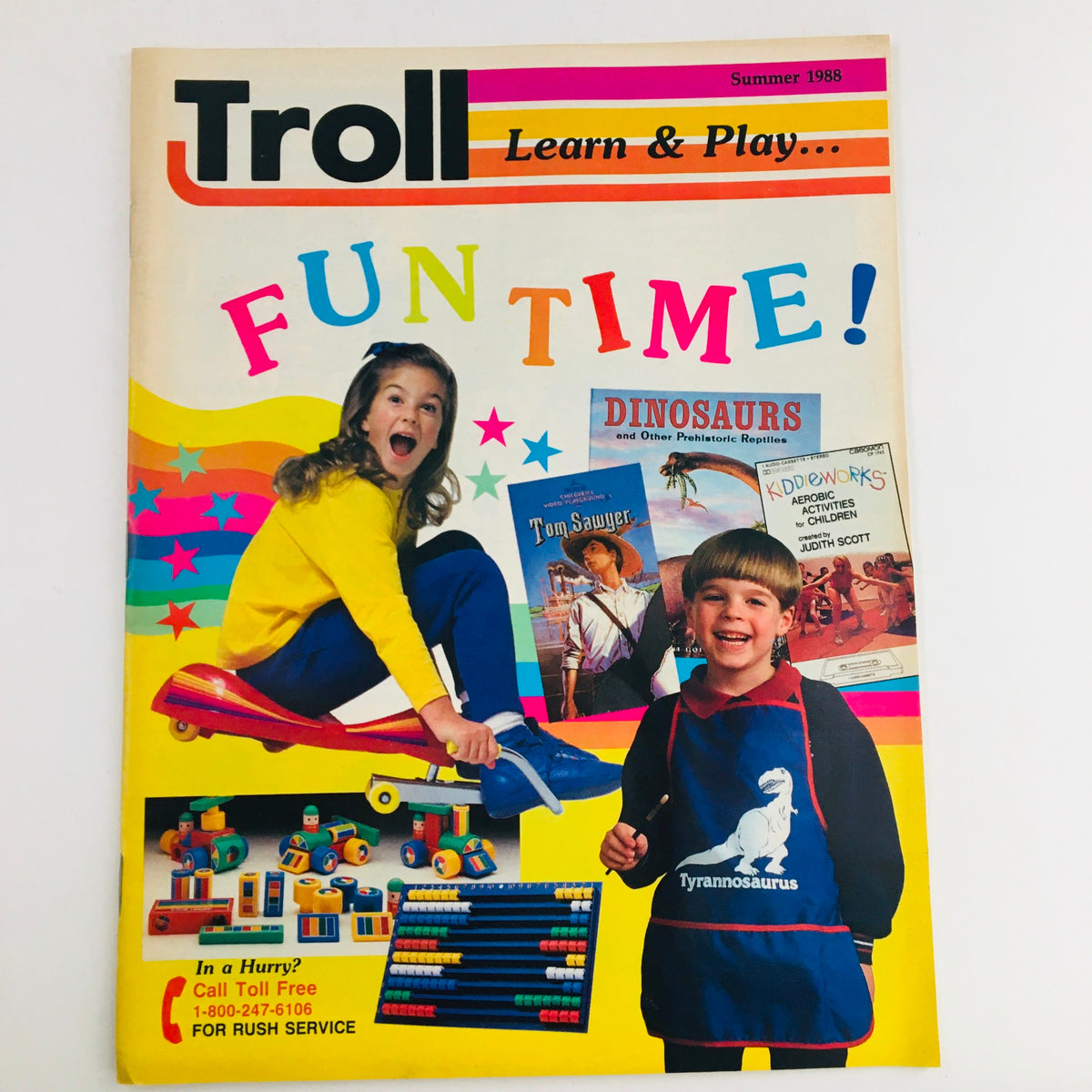 Cover of Troll Summer 1988 Learn & Play Fun Toy Vintage Catalog featuring a girl playing with toys and a boy in a dinosaur-themed apron, with colorful text and illustrations.