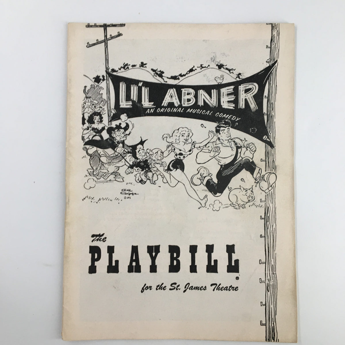 1957 Playbill for the musical Li'L Abner, featuring the title and illustrations of characters from the show, showcasing the original artwork from the St. James Theatre.