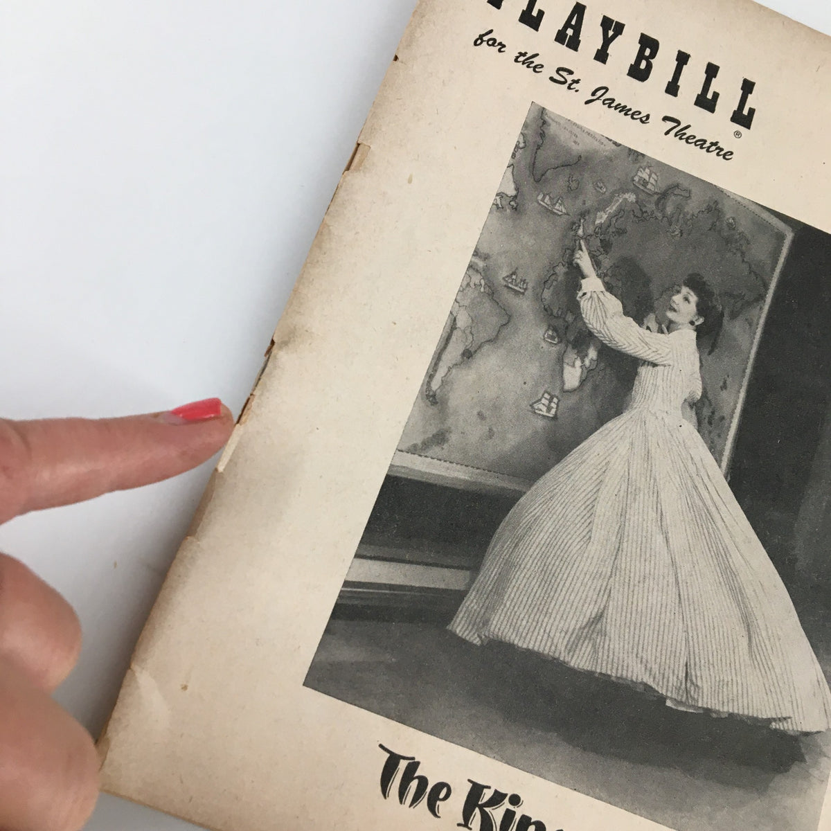 Close-up view of the 1951 Playbill for the St. James Theatre, highlighting the detailed vintage design and Gertrude Lawrence in The King and I.
