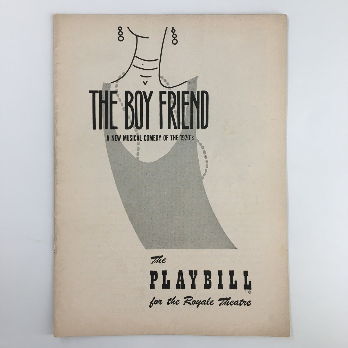 Front cover of the 1954 Playbill for The Boy Friend, a musical comedy at Royale Theatre featuring a vintage dress design.